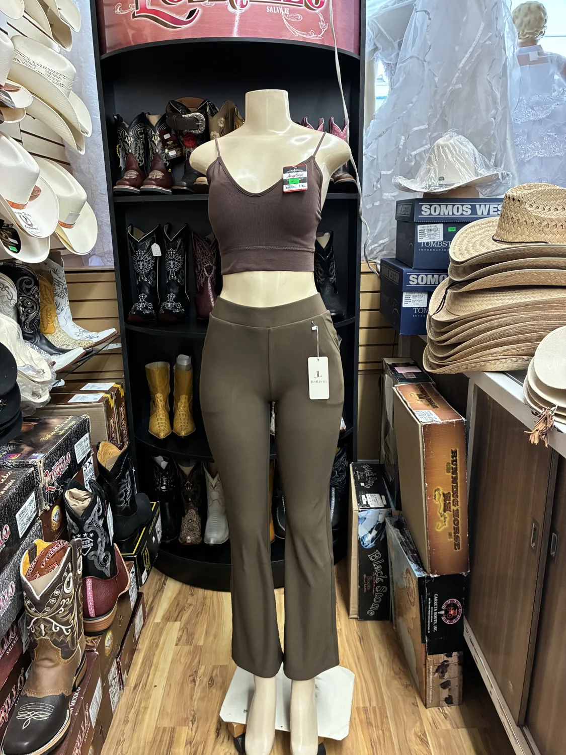 Brown top & olive trousers displayed on a mannequin