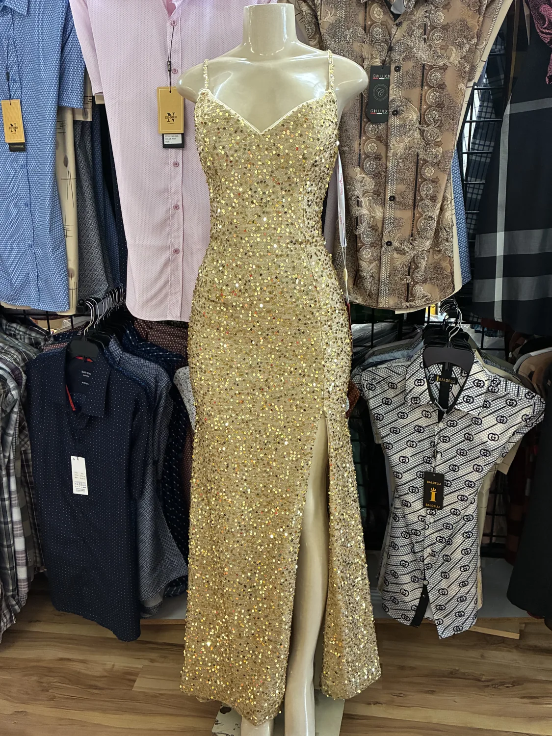 Gold sequin evening gown displayed on a mannequin