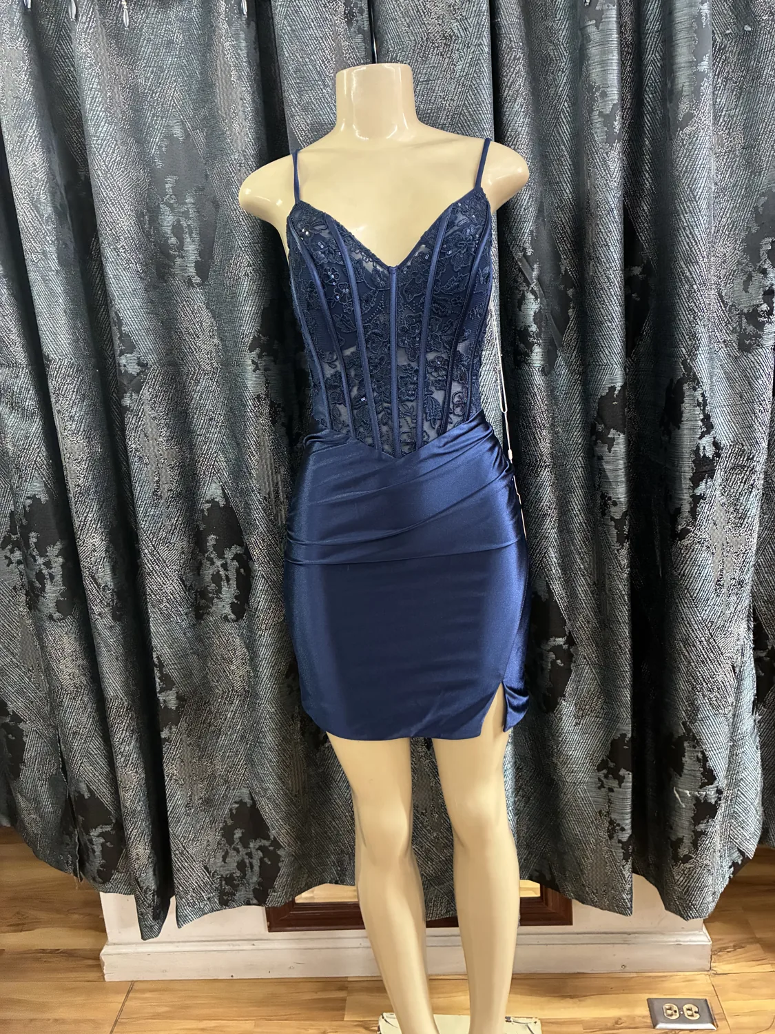 Navy beaded cocktail dress displayed on a mannequin
