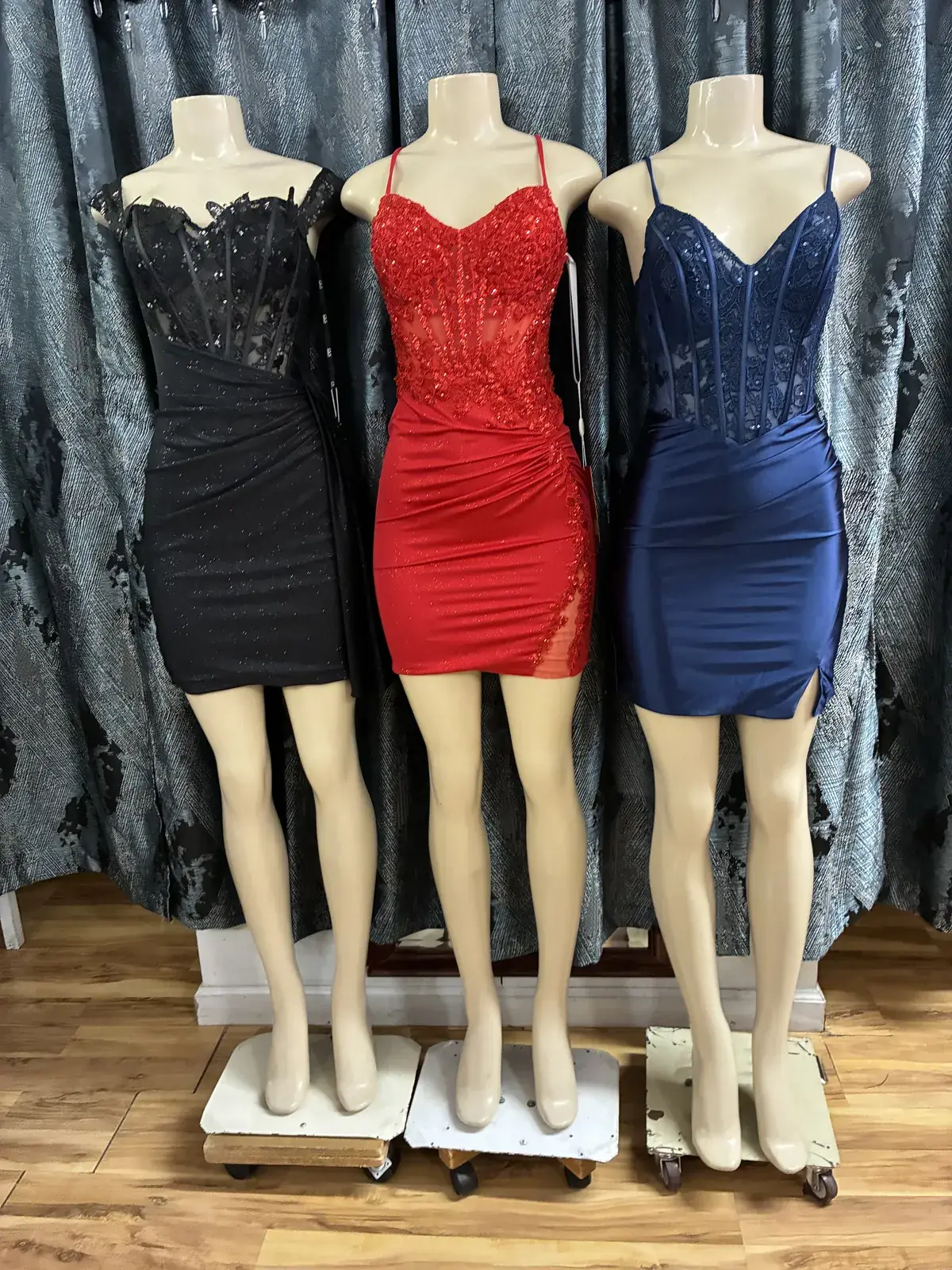 Black, red & navy cocktail dresses on display at Yessenia’s Fashion