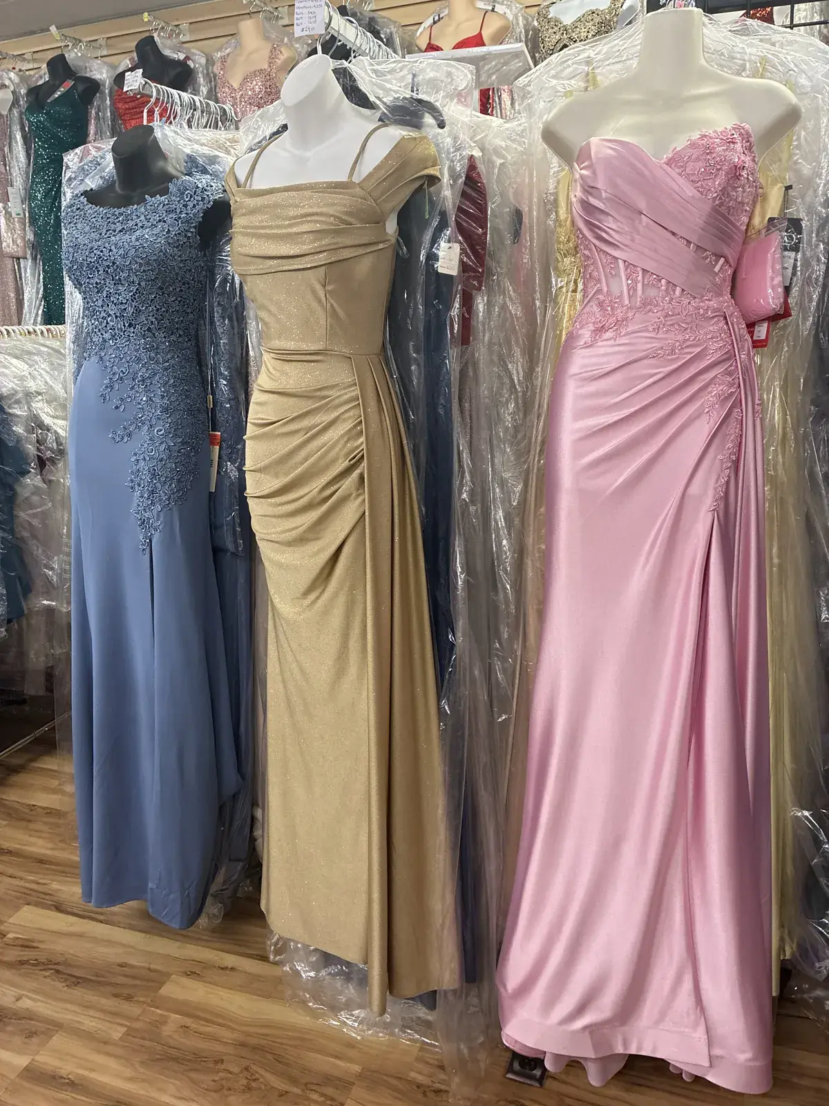 Blue, gold & pink evening gowns on display at Yessenia’s Fashion