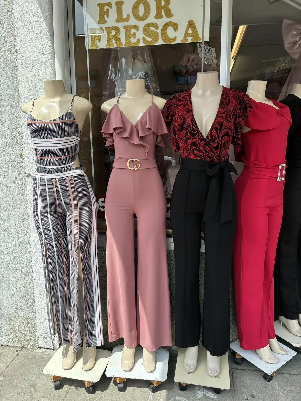 Jumpsuits in plaid, mauve, black & red on display at Yessenia’s Fashion