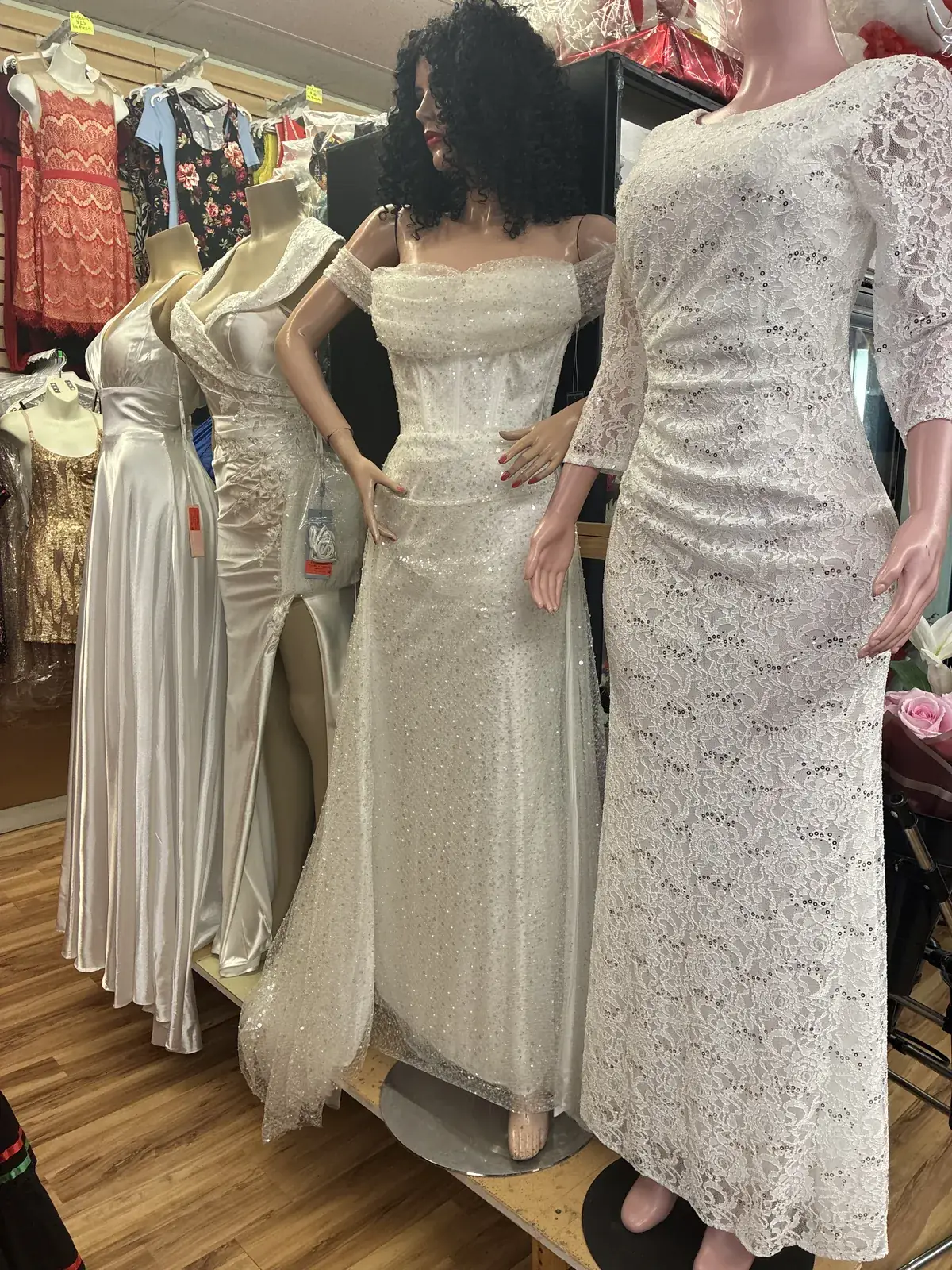 Lace & satin wedding gowns on display at Yessenia’s Fashion