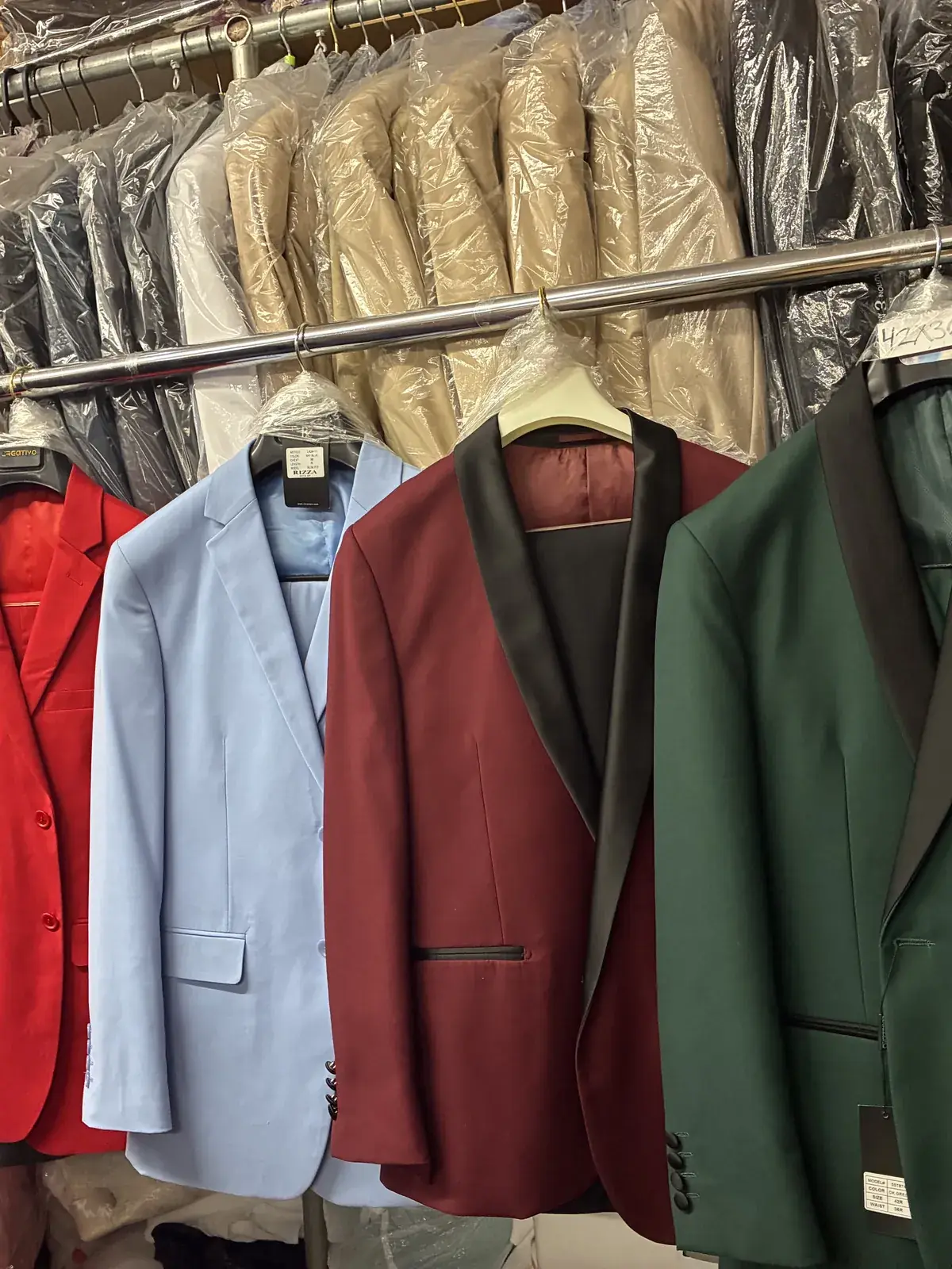 Men’s blazers in red, blue, burgundy & green on display at Yessenia’s Fashion