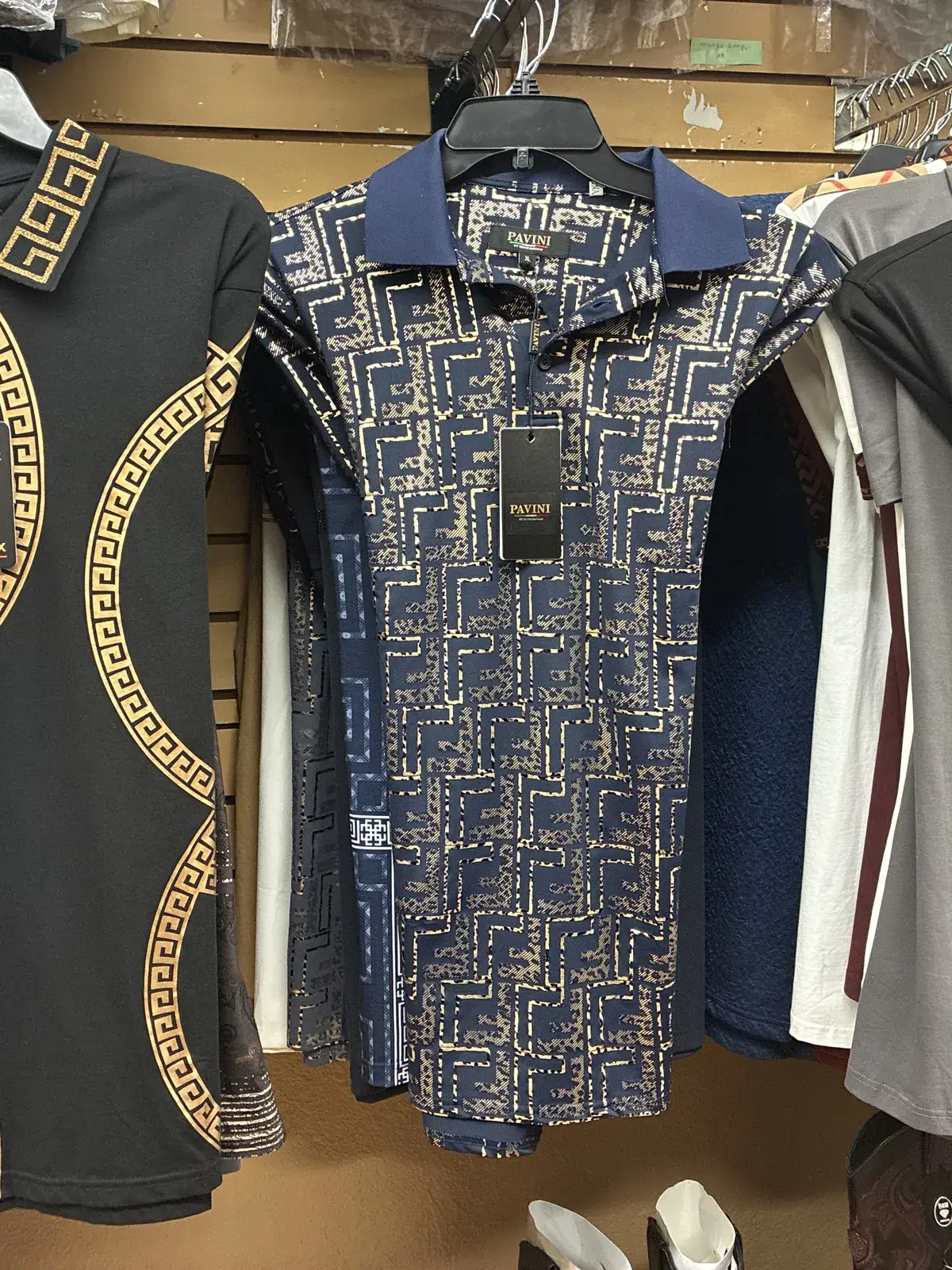 Men’s printed polos on display at Yessenia’s Fashion