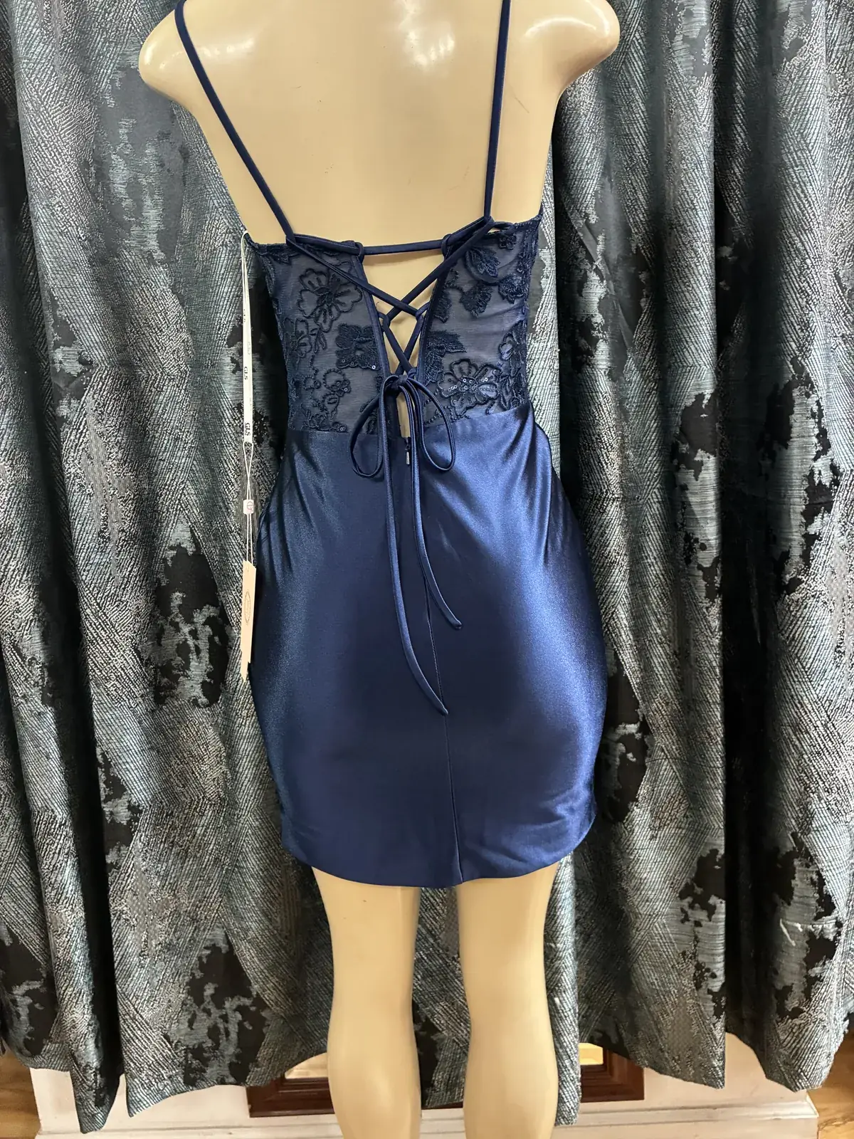 Navy cocktail dress, lace-up back on display at Yessenia’s Fashion